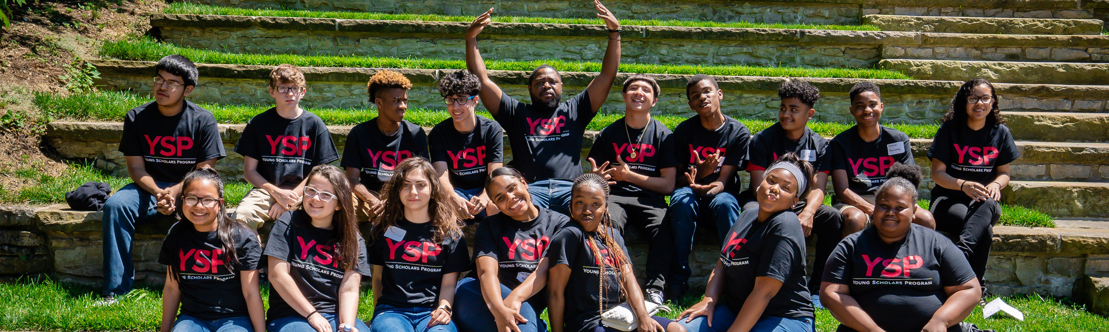 Young Scholars in YSP t-shirts sitting in the Ohio State Ampitheater
