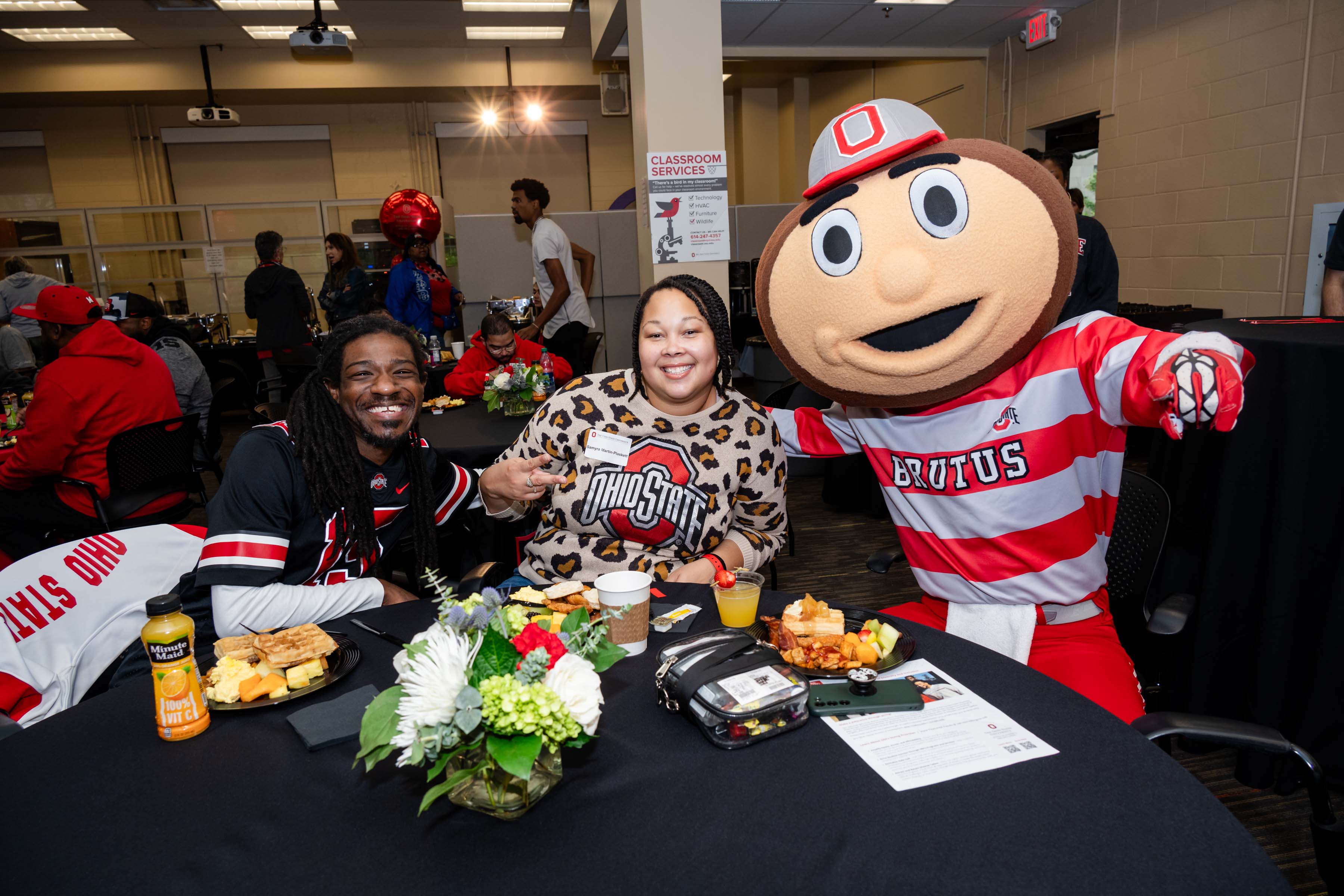 Brutus Buckeye taking a selfie with an ODI alumni