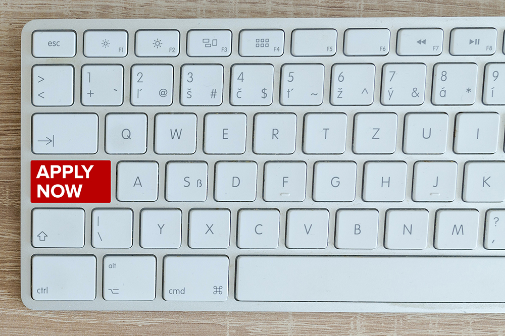 "Apply now" written on a key on a keyboard