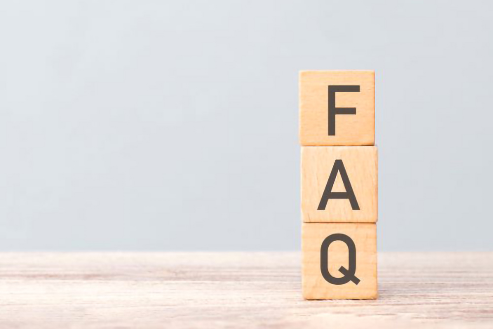 wooden block letters FAQ stacked on each other