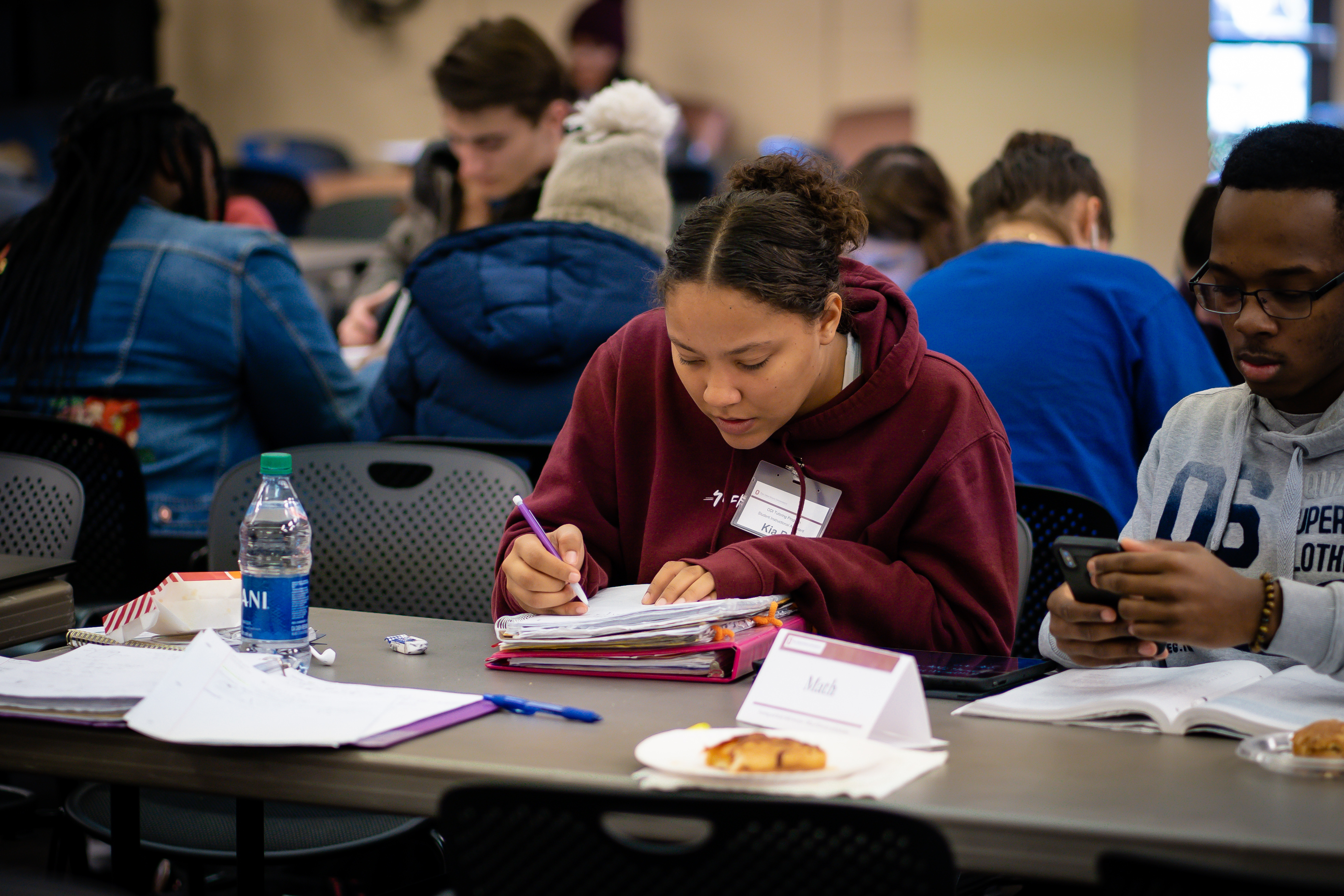 ODI Scholars sitting at table with other students studying.