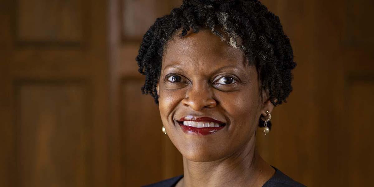 Andrea William, a Black woman, in pearl earrings