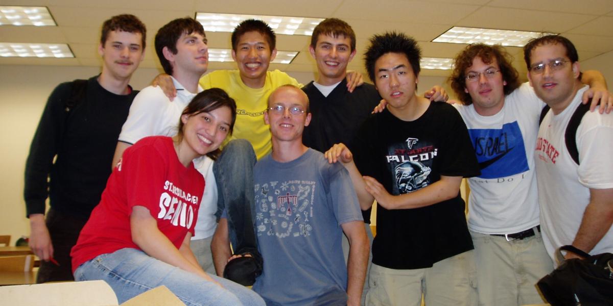 Group of students in casual clothes smiling for the camera