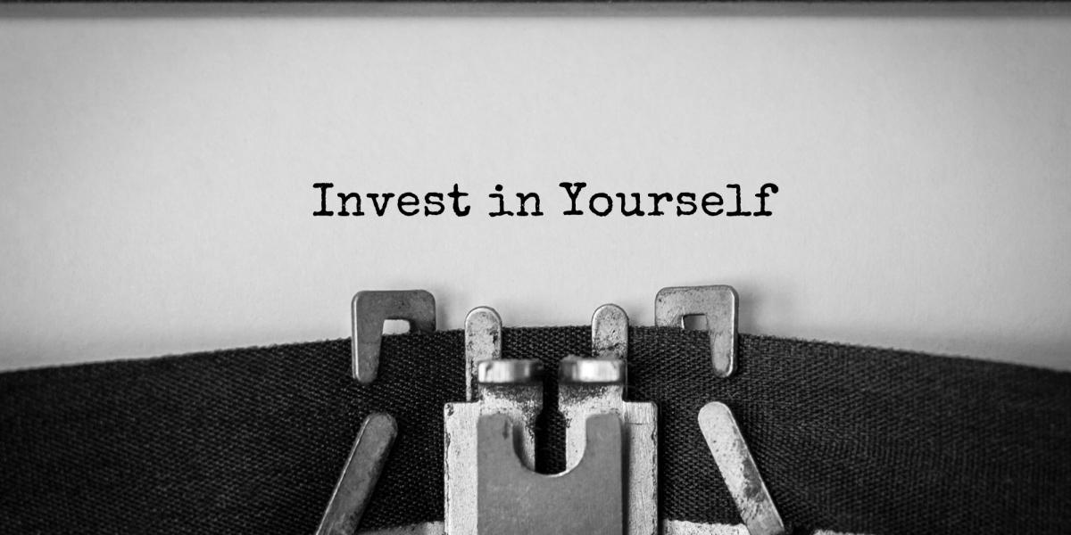 Typewriter that has typed "Invest in yourself."