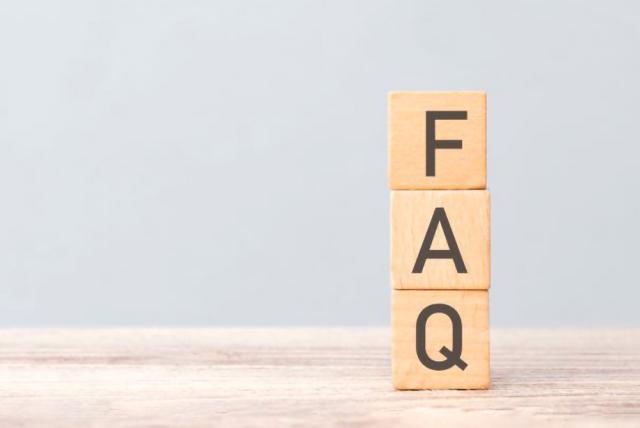 wooden block letters FAQ stacked on each other