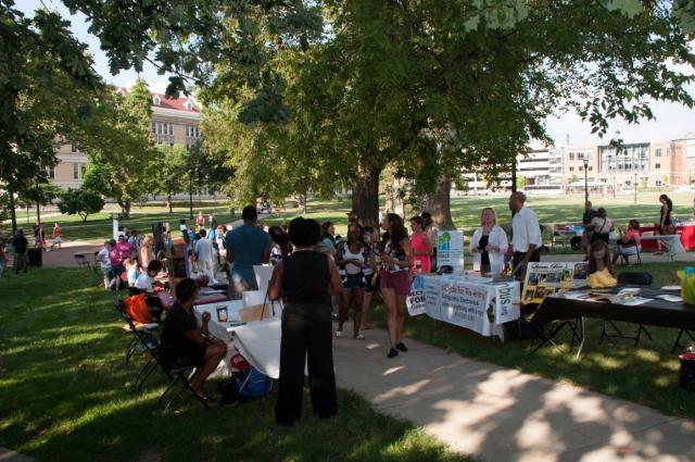 Family Fair Attendees on the South Oval at Ohio State visiting exhibitor tables