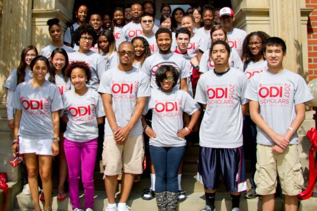 ODI Scholars in ODI t-shirts on steps of Hale Hall