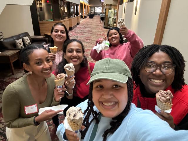 Diverse group of women hold ice cream cones while taking a selfie