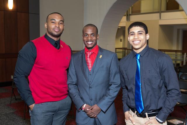 Three young Black men in suits and ties