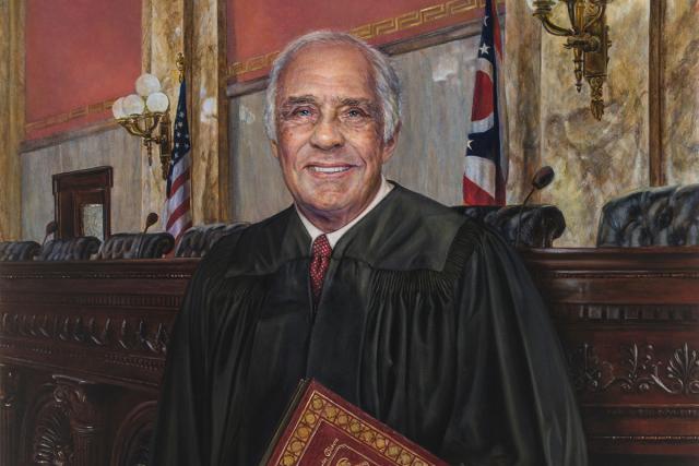 Judge Robert M. Duncan in judge's robes in a courtroom