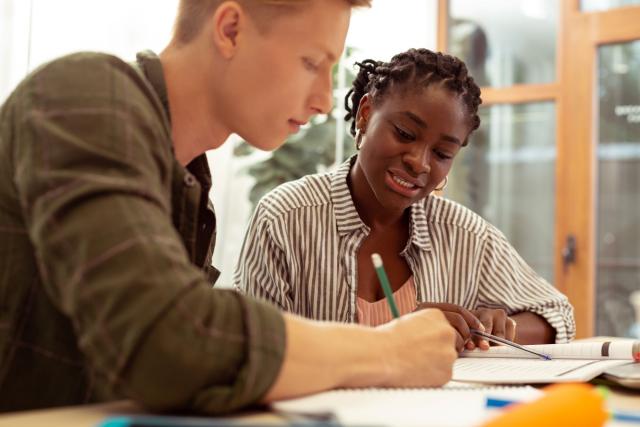 Two students working on schoolwork together