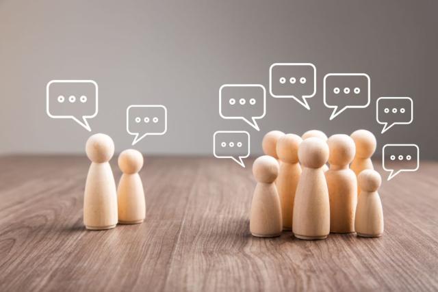 2 groups of wooden figures with thought bubbles over their heads