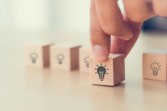 Wooden blocks with lightbulb images on them