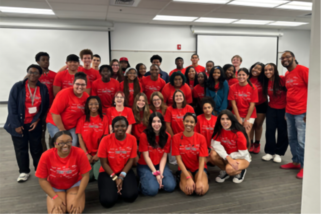 A group of students wearing red shirts