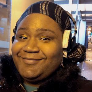 Shawn Gardner smiling with headphones on