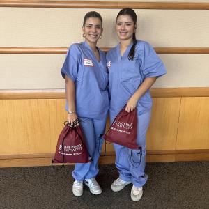 Cristina and Isabela Reina in light blue scrubs